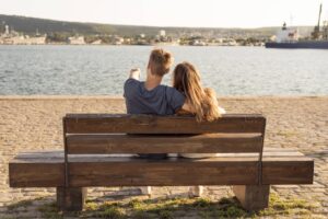 back-view-couple-sitting-bench